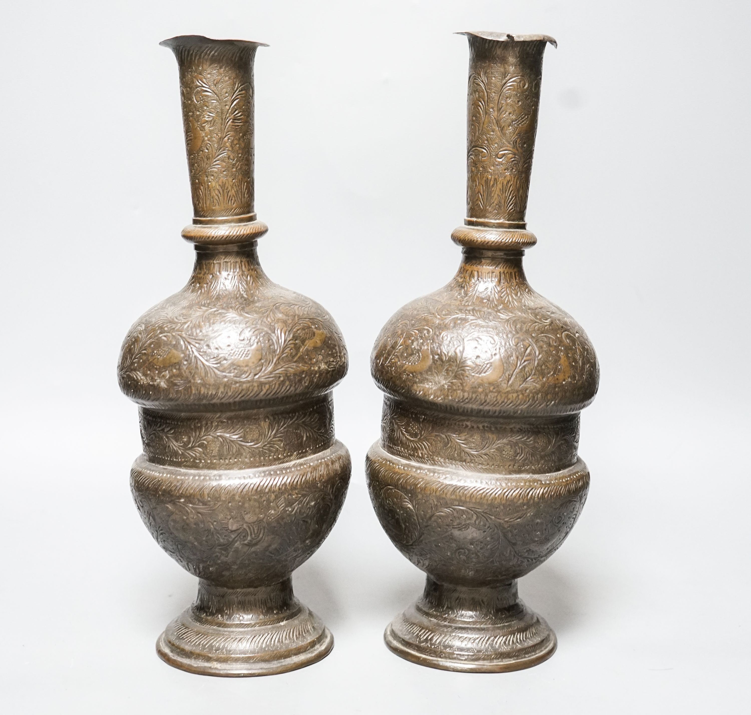 A pair of Persian engraved vases 32cm